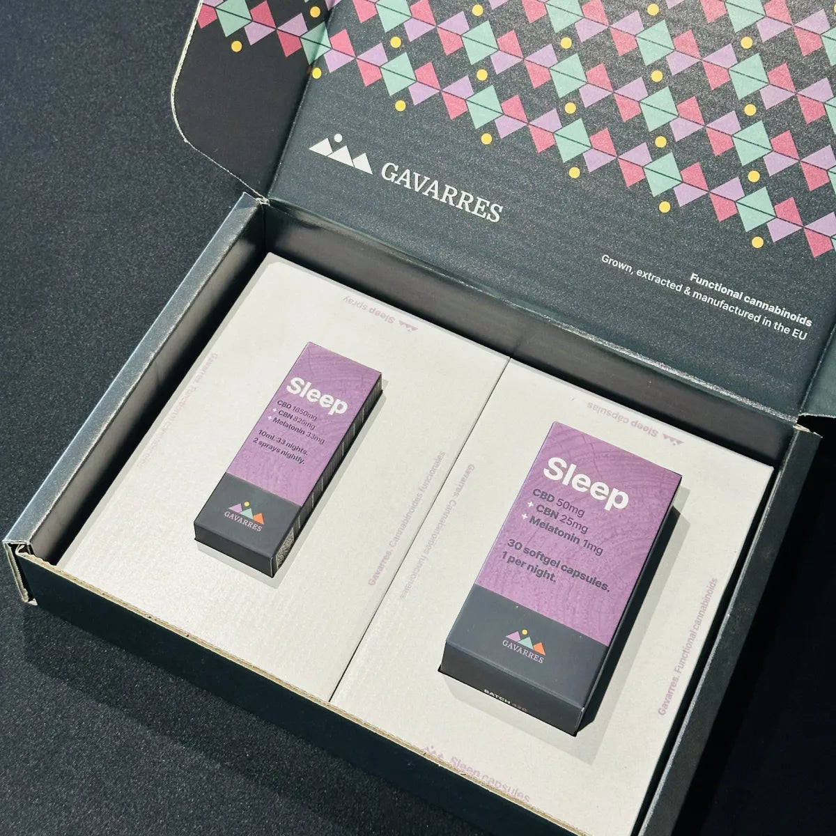 A boxed packet of Sleep capsules and spray placed inside its open Gavarres branded presentation packaging